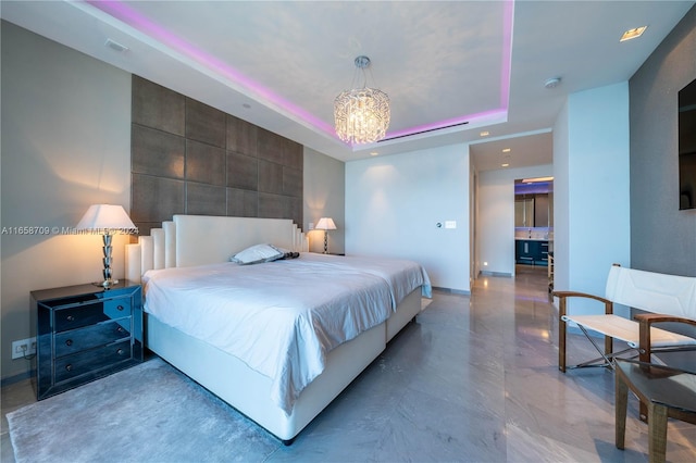 bedroom featuring a raised ceiling and tile walls