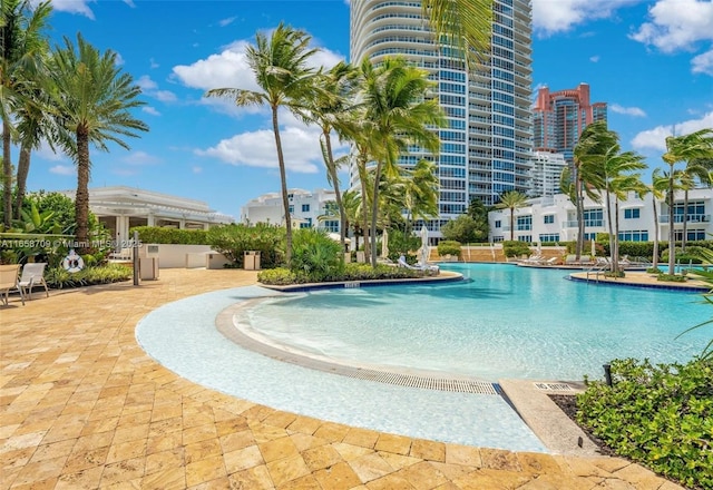 view of pool featuring a view of city