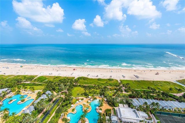 bird's eye view featuring a view of the beach and a water view