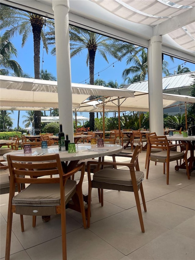 view of patio featuring outdoor dining area