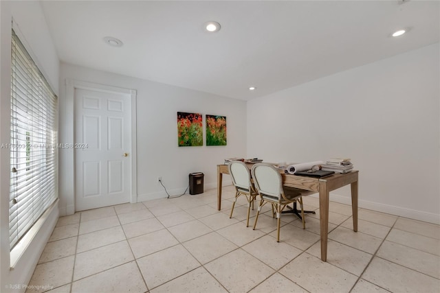 dining area featuring light tile patterned floors