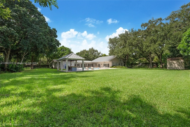 view of yard featuring a gazebo and a patio area