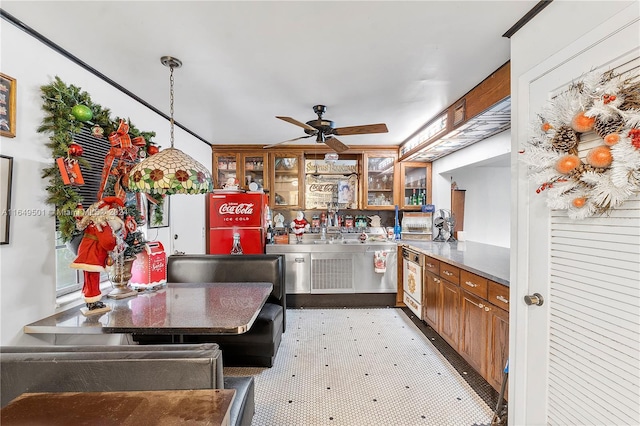 620 Tennis Club Dr Unit 111, Fort Lauderdale, FL 33311 - kitchen featuring freestanding refrigerator, ceiling fan, glass insert cabinets, and brown cabinets