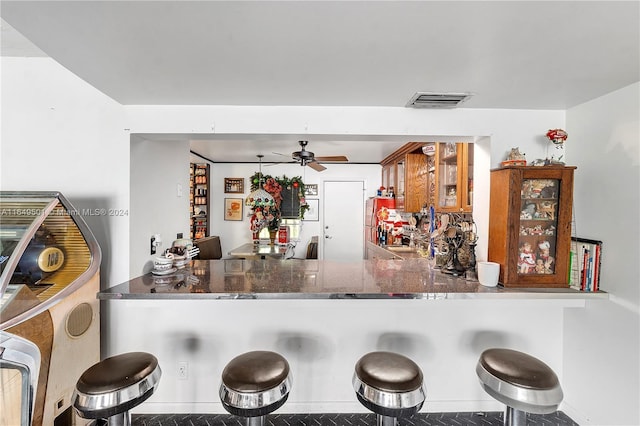 620 Tennis Club Dr Unit 111, Fort Lauderdale, FL 33311 - bar with ceiling fan, visible vents, and freestanding refrigerator
