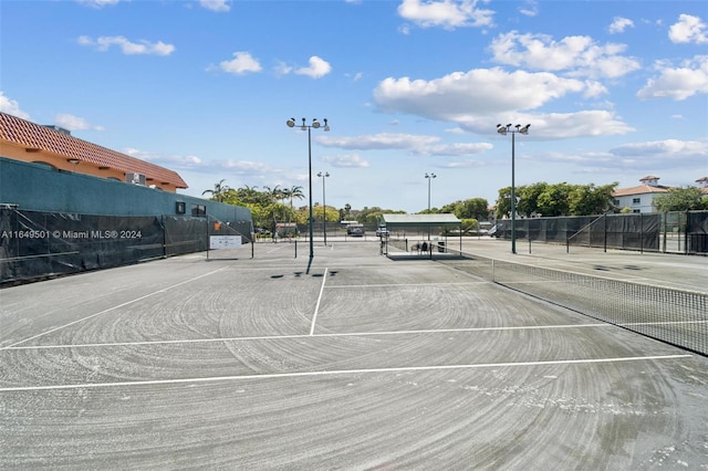 view of community with tennis court