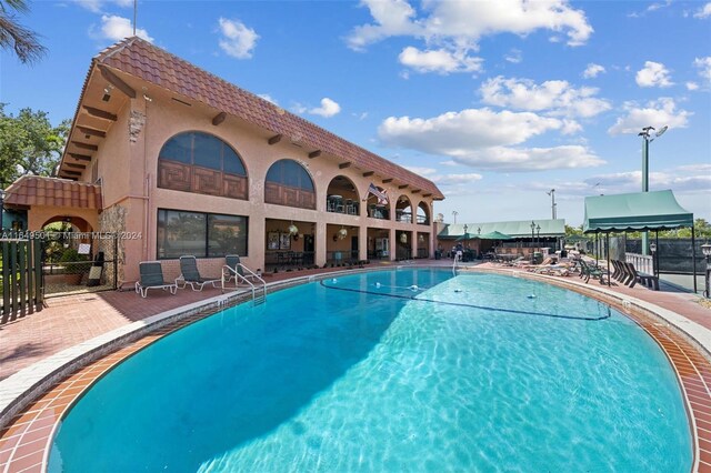 620 Tennis Club Dr Unit 111, Fort Lauderdale, FL 33311 - pool featuring a patio and fence