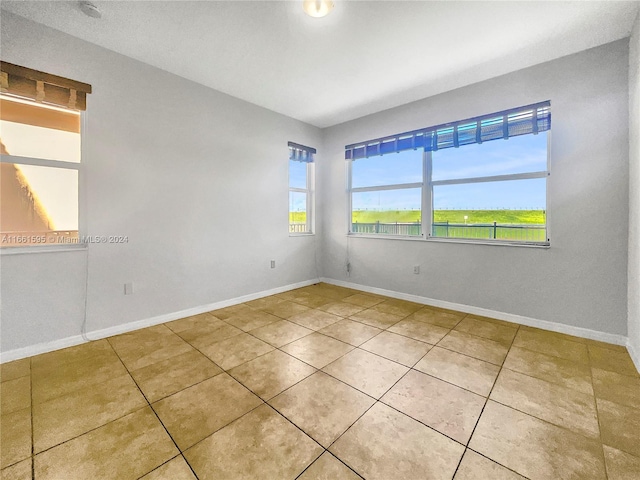 empty room featuring tile patterned flooring