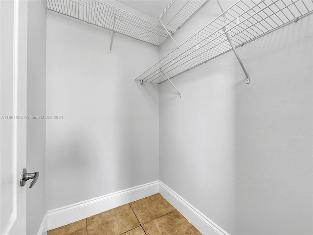 spacious closet with tile patterned flooring