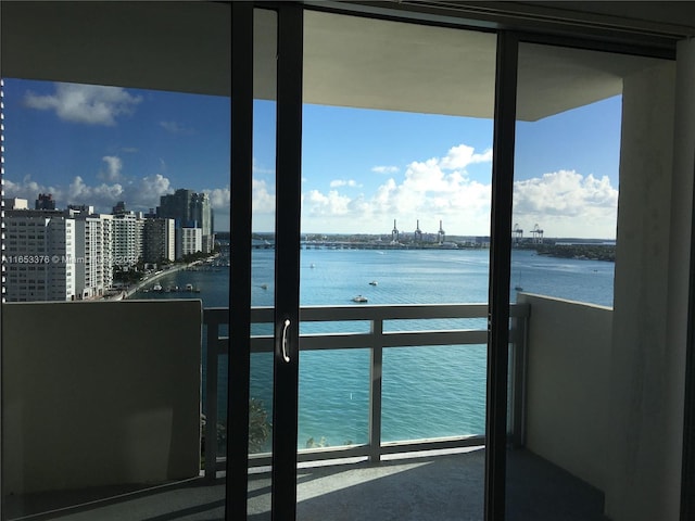 balcony featuring a water view