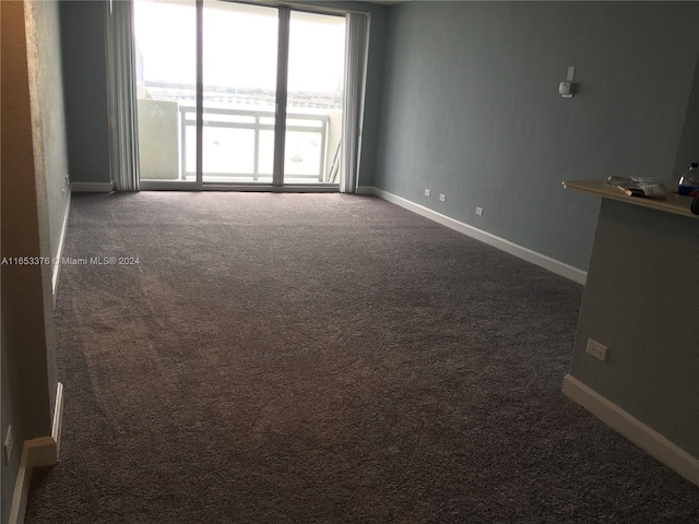 empty room with dark carpet