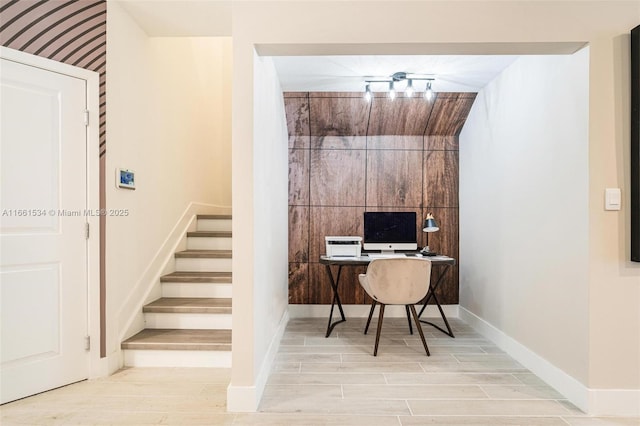 office featuring baseboards and wood finish floors