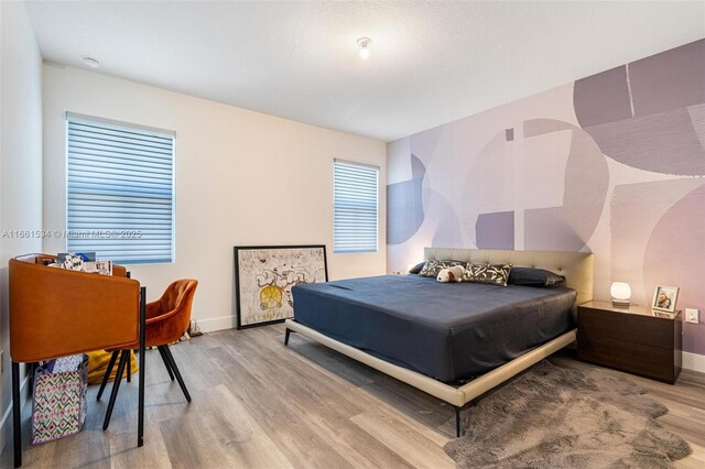 bedroom with light wood-type flooring