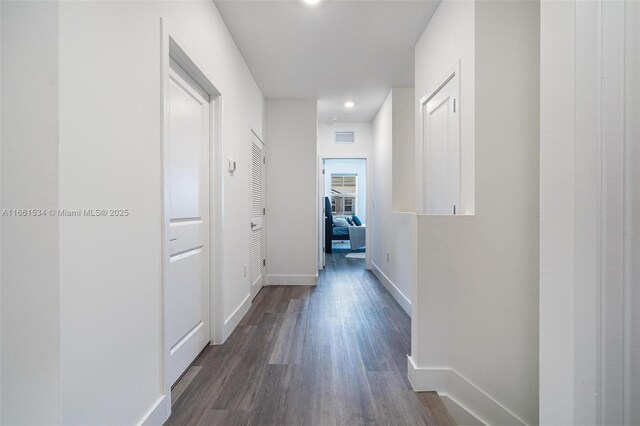 hallway featuring dark wood-type flooring