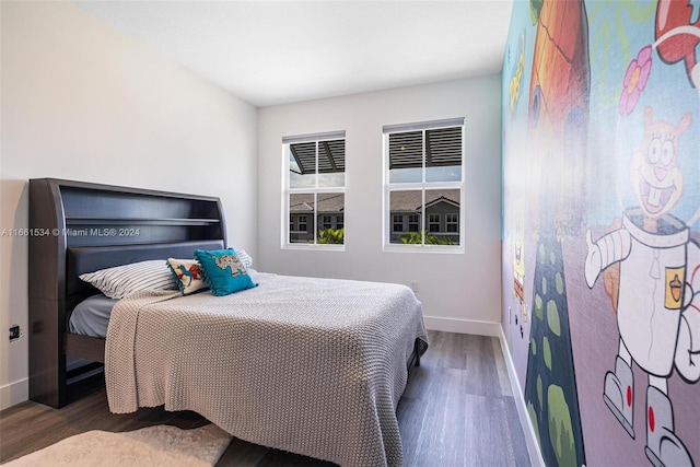 bedroom with dark wood-type flooring