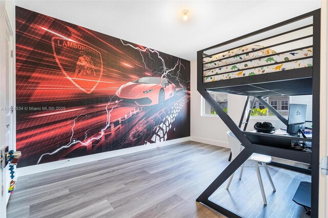 bedroom featuring wood-type flooring