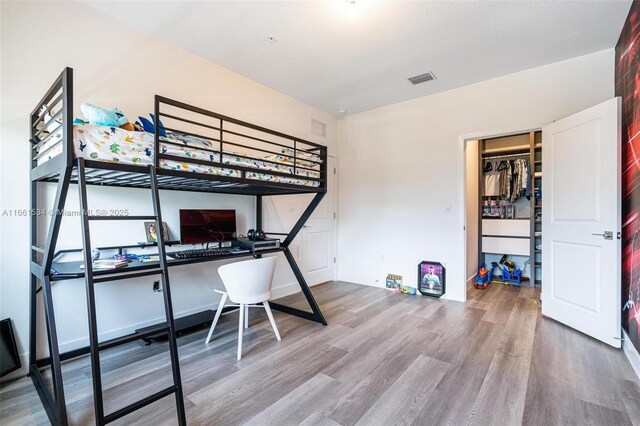 bedroom featuring hardwood / wood-style floors