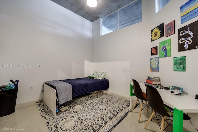 bedroom with a towering ceiling