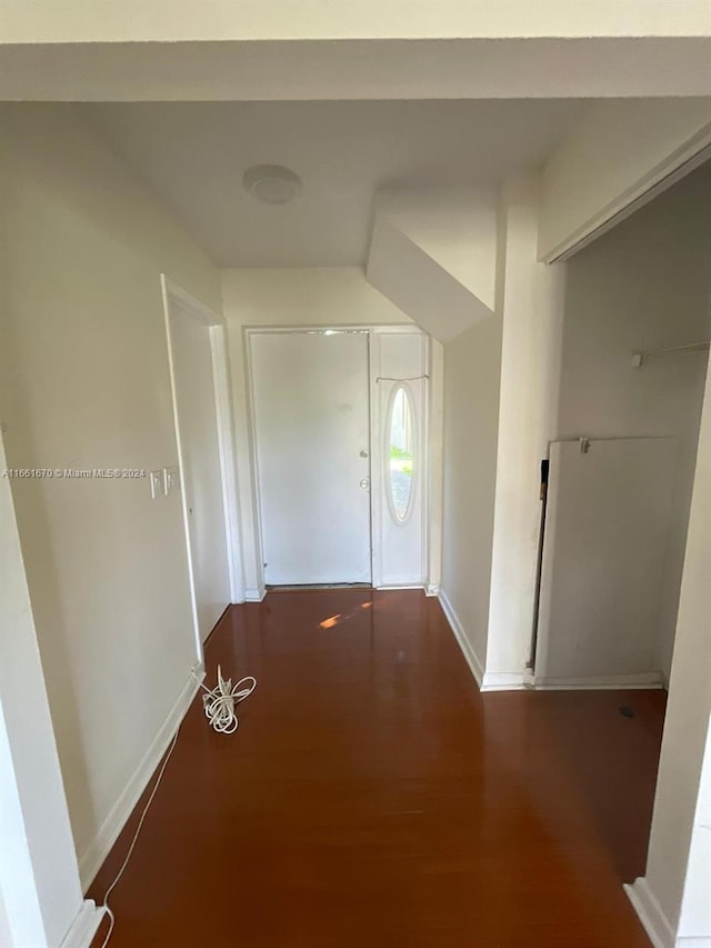 corridor with dark wood-type flooring