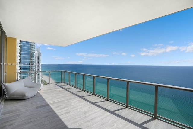 balcony featuring a water view