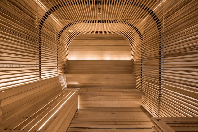 view of sauna / steam room featuring wood walls