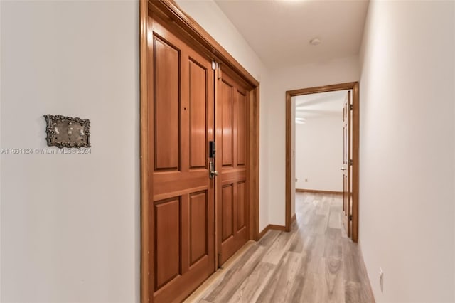 hallway featuring light wood-type flooring