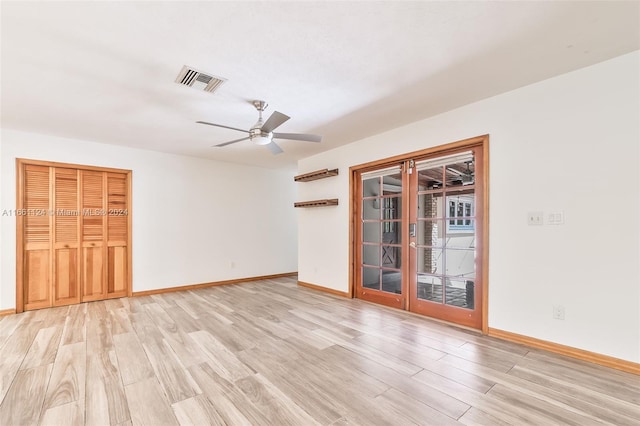 unfurnished room with light hardwood / wood-style flooring and ceiling fan