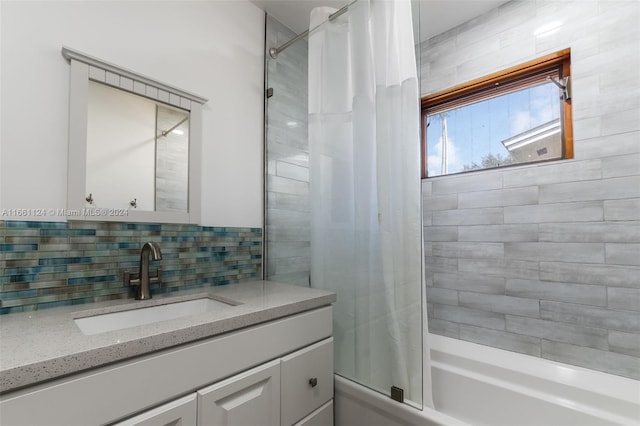 bathroom with shower / bathtub combination with curtain, decorative backsplash, and vanity