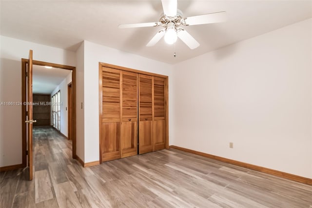 unfurnished bedroom with a closet, ceiling fan, and hardwood / wood-style flooring