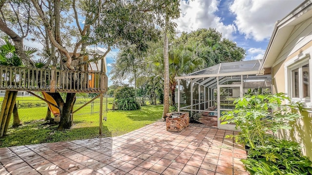 view of patio / terrace featuring a lanai