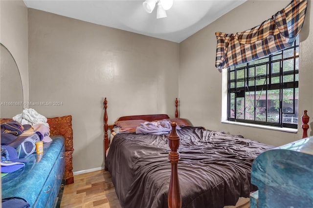 bedroom featuring light hardwood / wood-style flooring and ceiling fan