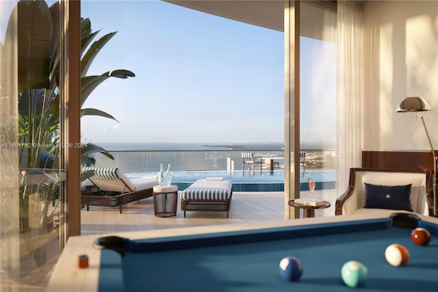 interior space featuring a water view and billiards