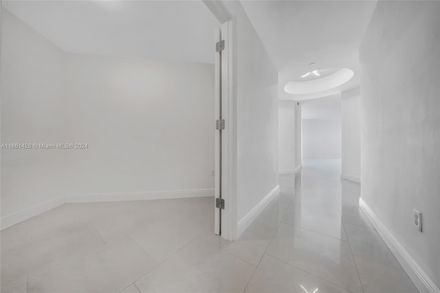 hallway with light tile patterned floors