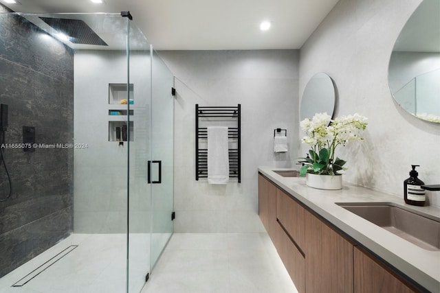 bathroom with vanity and a shower with shower door