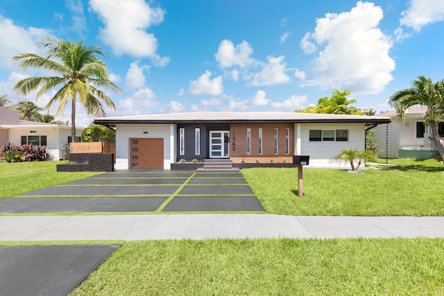 ranch-style house with a front lawn and a garage