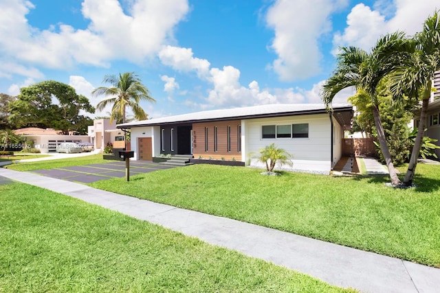 ranch-style house with a front yard