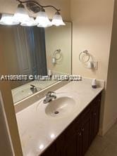 bathroom with vanity and tile patterned flooring