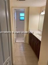 bathroom with vanity and tile patterned floors