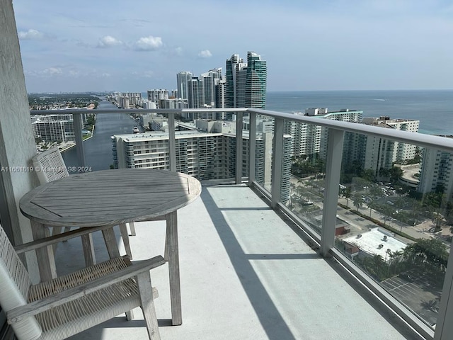 balcony featuring a water view