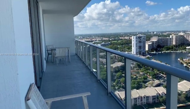 balcony featuring a water view