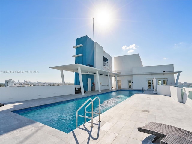 view of swimming pool featuring a patio area