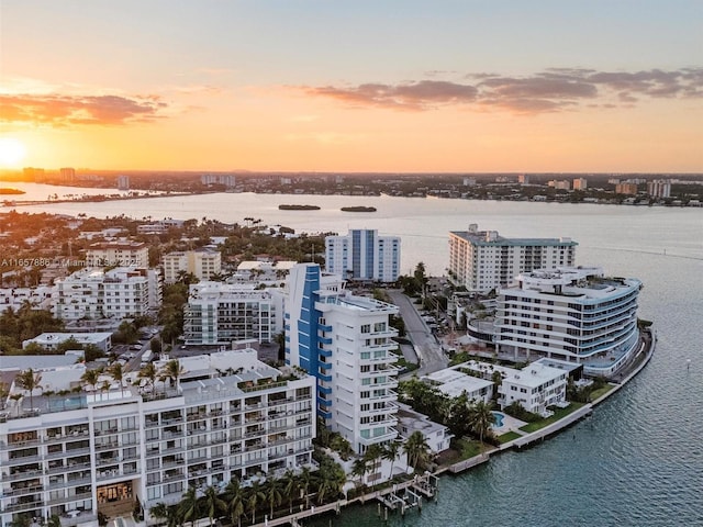 aerial view at dusk with a water view