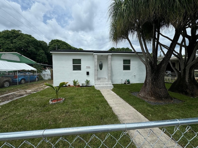 view of front of property with a front lawn