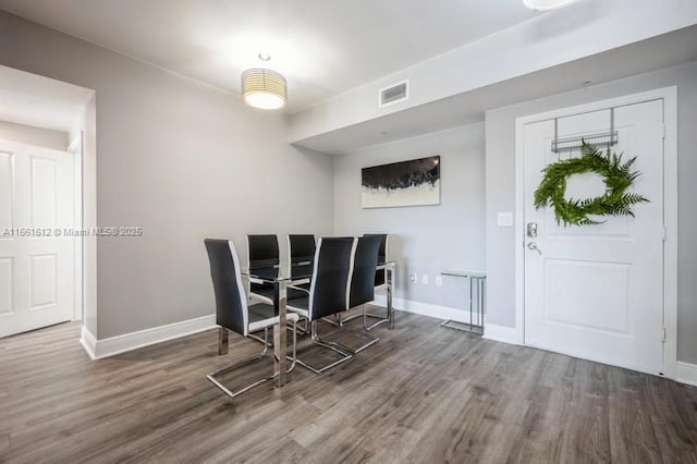 unfurnished dining area with dark hardwood / wood-style floors