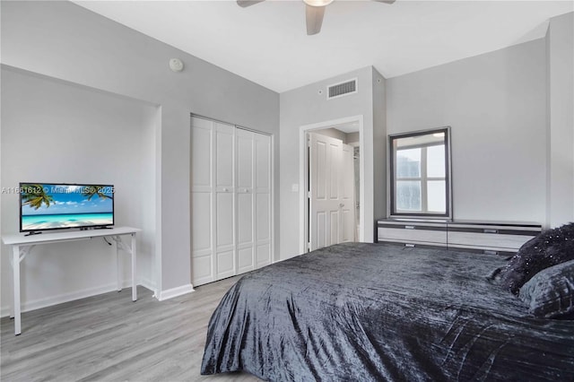 bedroom with light wood-type flooring and ceiling fan