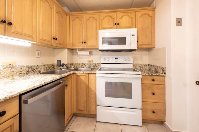 kitchen with decorative backsplash, white appliances, light tile patterned flooring, and sink