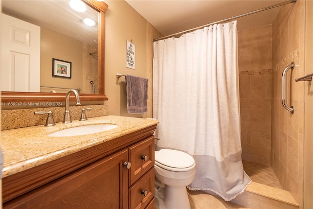 bathroom featuring walk in shower, vanity, toilet, and tile patterned floors