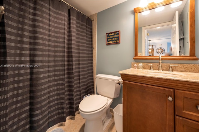 bathroom featuring walk in shower, vanity, and toilet