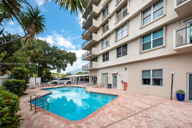 view of pool featuring a patio area