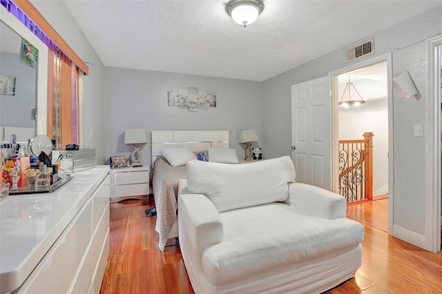 bedroom featuring light hardwood / wood-style floors