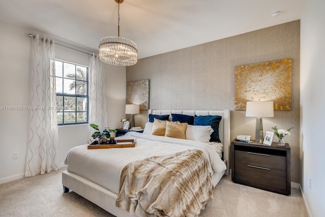 bedroom featuring light carpet, baseboards, and a notable chandelier
